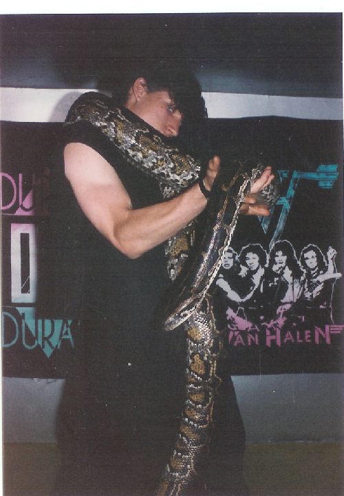 Bob's model Woody Steele, aka Max Hardon poses with his pet snake circa 1984.