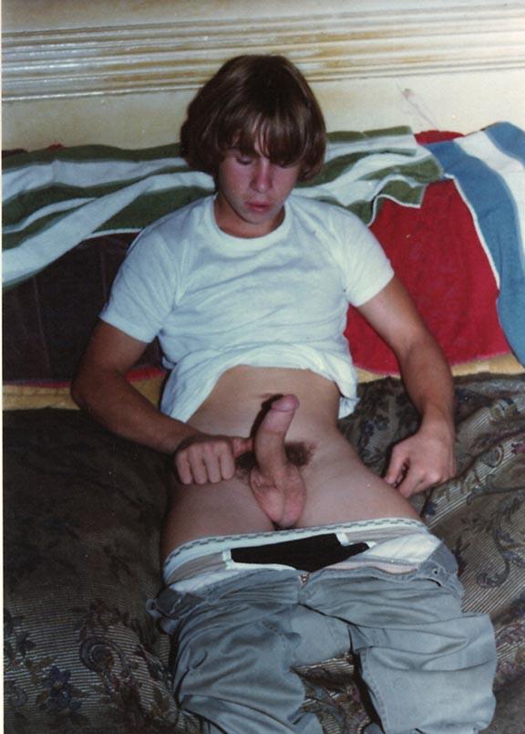 Teenaged hustler in the 1970s playing with his dong.