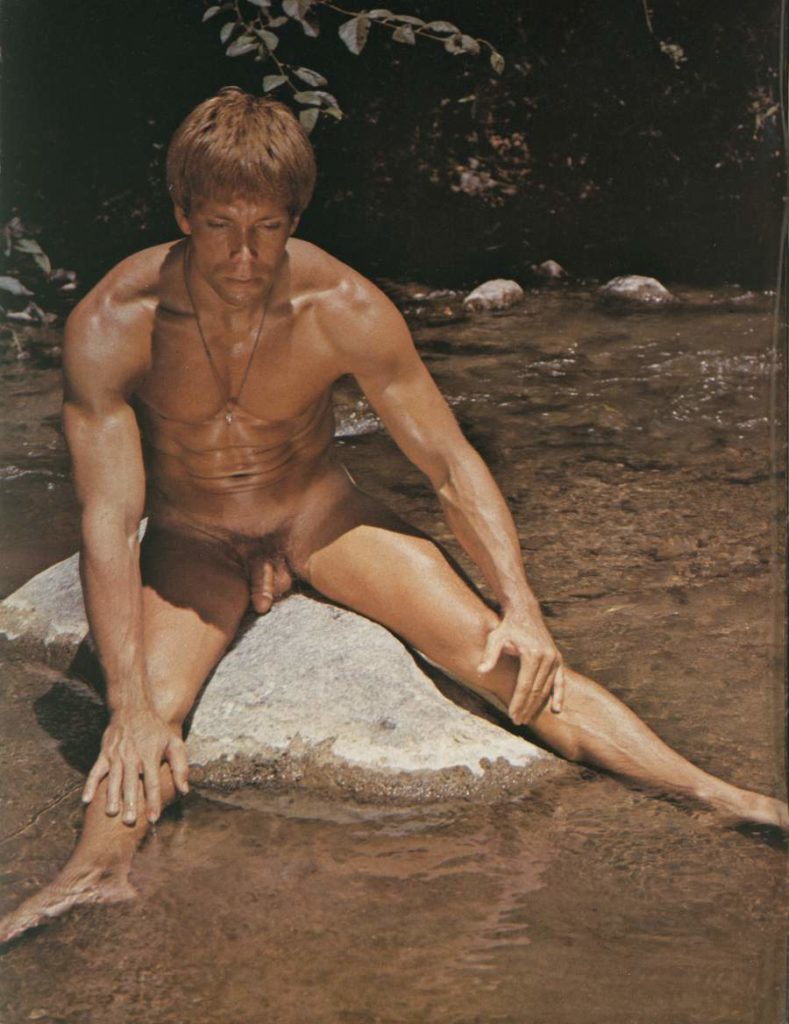 Dennis Johnson poses nude on a rock in the river for David Carter in the 1970s.