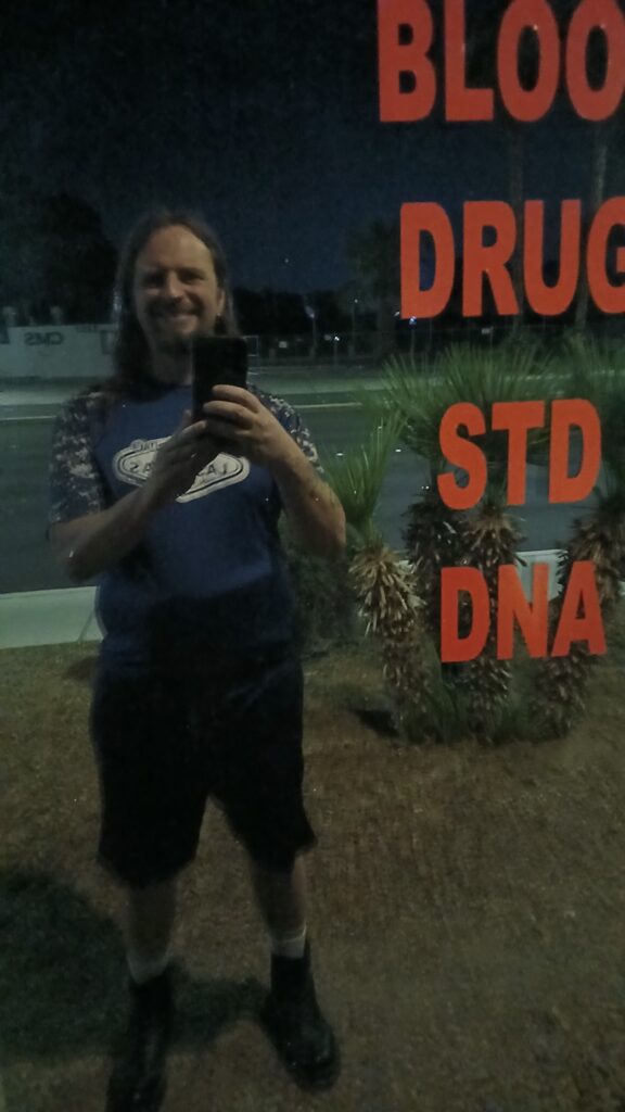 BLOOD DRUG STD DNA sign with my reflection.